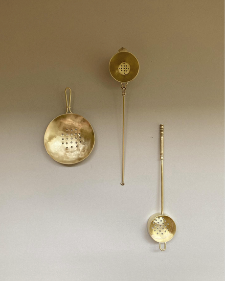 Tea Strainer collection handcrafted by Misae Nikkei, featuring various brass designs with perforated bowls, ideal for straining tea, scooping pickles, or sifting spices.