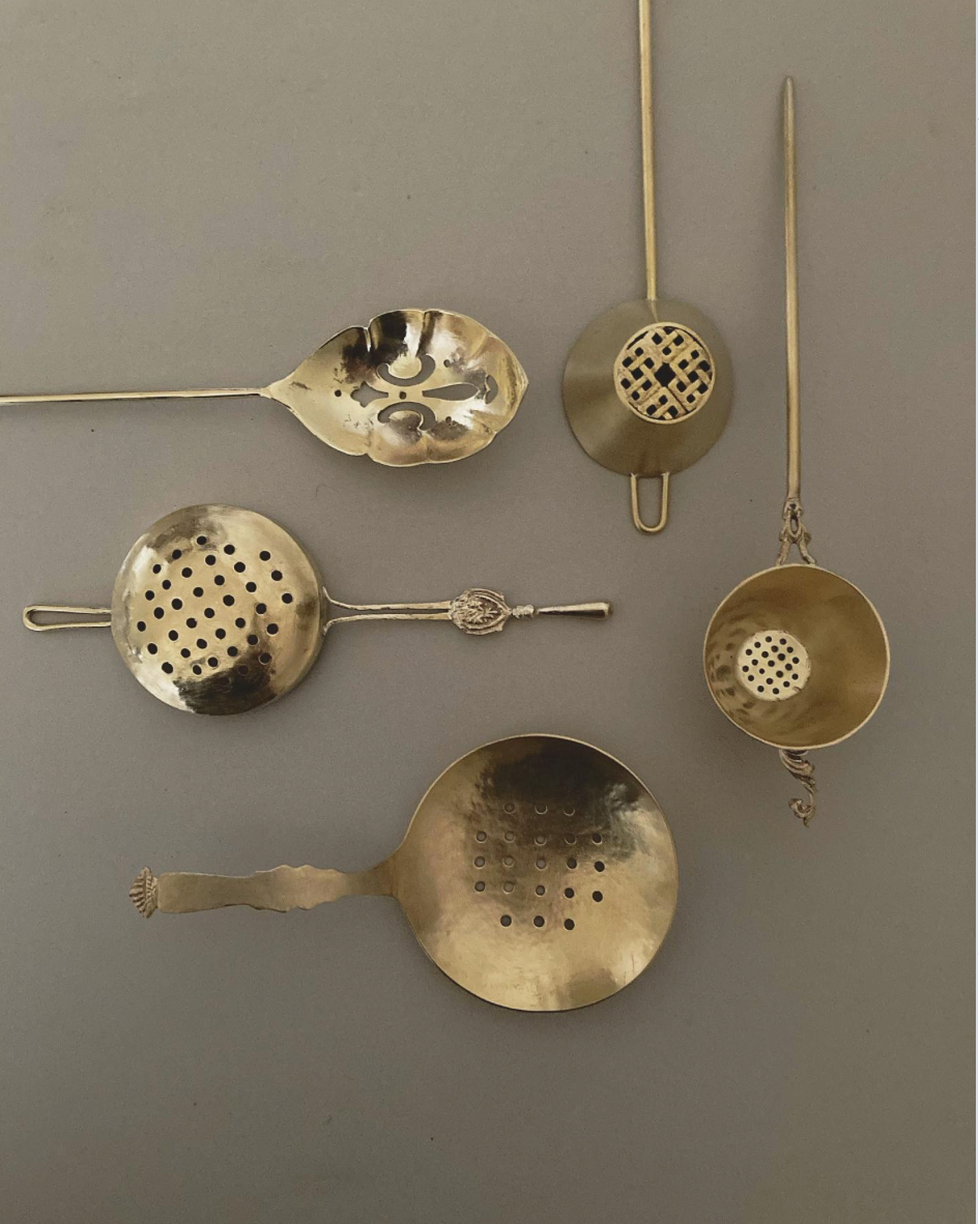 Tea Strainer collection handcrafted by Misae Nikkei, featuring various brass designs with perforated bowls, ideal for straining tea, scooping pickles, or sifting spices.