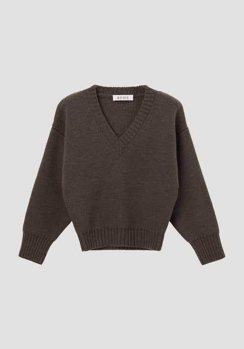 Sculptural compact v-neck | forest melange knit pullover sweater features a deep V-neck, dropped shoulders, ribbed cuffs, and hem, made from 100% wool by RÖHE.
